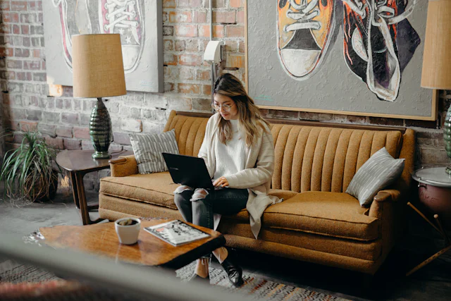 Woman preparing her ITIN application on a laptop at home